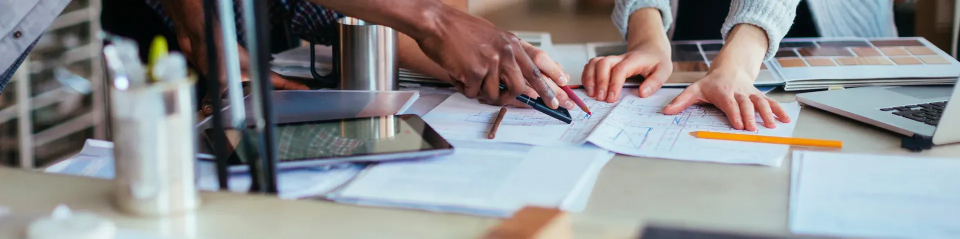 Team working together over documents on a desk